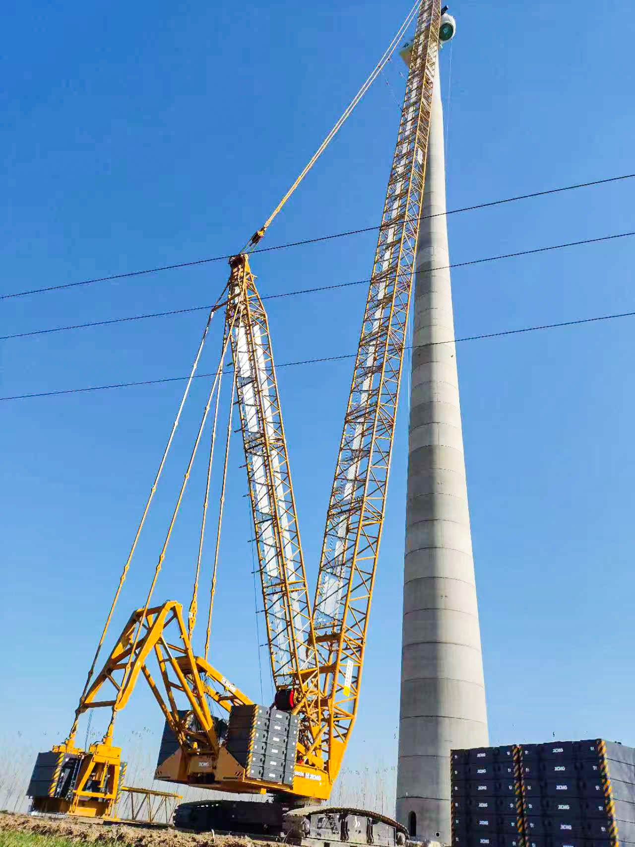 160米高空精准“搭积木”：开云电子·「中国」官方网站XLC15000M分体吊装6.25兆瓦风机全纪录